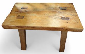 A rustic rectangular table/stool on four square su