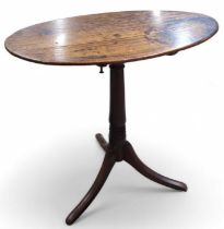 A Georgian mahogany pedestal wine table