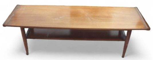 A c.1970's rectangular teak coffee table with lowe