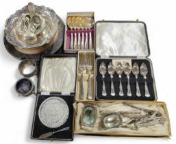 A cased set of six grapefruit spoons together with