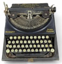 An early Remington Home Portable typewriter in cas