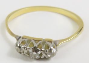 An unmarked old cut diamond three stone ring, fing
