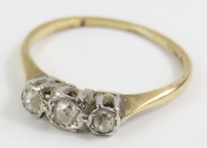 A three stone old cut diamond ring, marked '18ct p