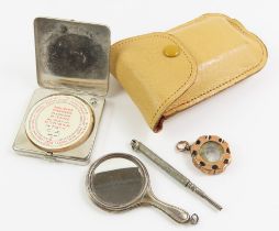 A silver miniature hand mirror, a gold cased minia