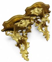 A pair of Rococo style gilt wood wall brackets, 29