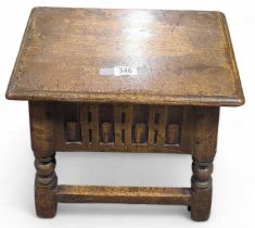 An oak stool/workbox and contents