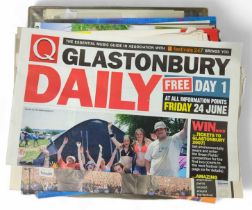A quantity of Glastonbury Festival programmes and