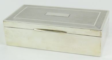 A rectangular silver cigarette box with guilloche