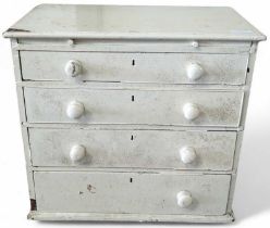 A small painted chest of four long drawers 70cms h