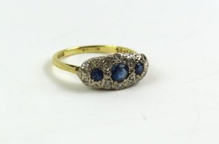 An 18ct gold sapphire and diamond triple cluster r