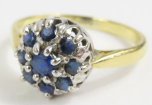 A sapphire cluster ring, finger size P,