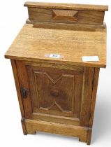 An oak bedside cabinet, 68cms high max