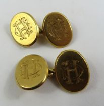 A pair of 18ct gold cufflinks, each oval panel wit