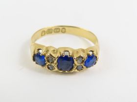 A Victorian 18ct gold blue paste and diamond ring, the three s