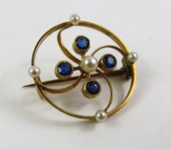 An Edwardian sapphire and pearl brooch, the round