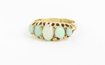 An 18ct gold opal five stone ring, the five oval c