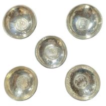 Four contemporary silver coin-set dishes, various dates and makers, each of circular