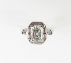 An Art Deco style platinum and diamond ring, the c