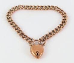 A rose gold curb link bracelet, with puff heart pa