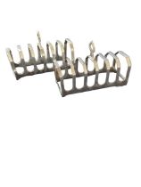 A pair of silver seven-division toast racks, by Vi