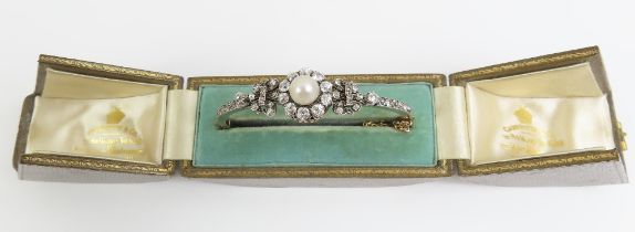 A Victorian pearl and diamond hinged bangle, with