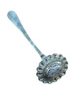 A continental white metal sugar sifter spoon, the