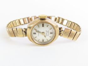 Everite - a ladies 9ct gold wristwatch, the round