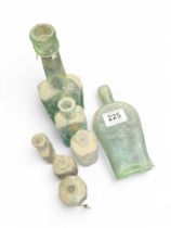 A small group of medicine bottles including Aplin'