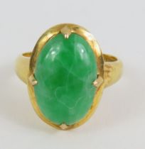 A dyed jadeite ring, the oval cabochon cut stone s