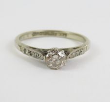 An old cut diamond solitaire ring, with diamond se