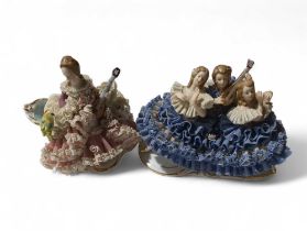 Two West German porcelain figures - lady playing a