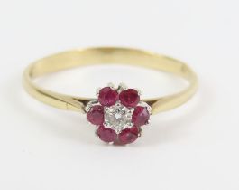 A 9ct gold ruby and diamond cluster ring, finger s