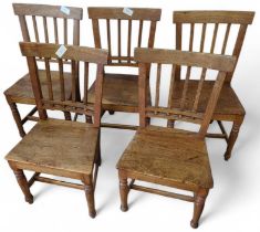 A set of five oak dining chairs, stick backs and w