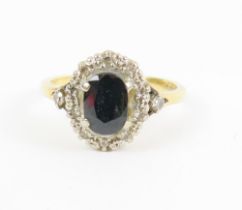 An 18ct gold sapphire and diamond cluster ring, wi