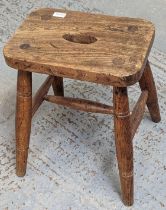 An pine and elm (?) stool, with hole to centre of