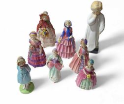 A group of early, small Royal Doulton figures - De