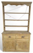 A 20th Century stripped pine kitchen dresser 226cms