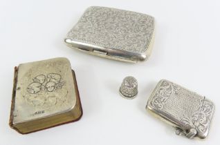 A silver cigarette case, a silver vesta case, a si