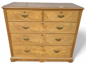 A late Victorian satinwood chest of two short and