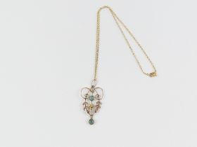 An Edwardian two colour gold pendant, set with two