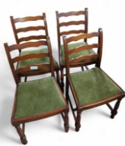 A set of four oak ladder back dining chairs, with