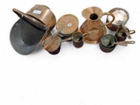 A selection of Victorian copper pans, jug, coal he