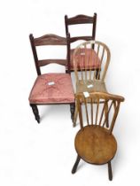 A pair of mahogany dining chairs, with pink uphols