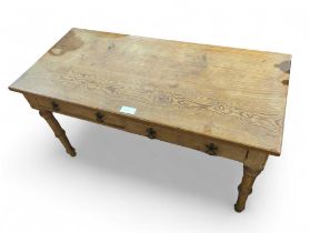 A Victorian pitch pine side table fitted with two