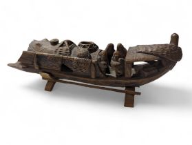 A Chinese carved bamboo boat with figures, 25cms l