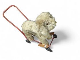 A vintage Pedigree push along dug, the plush coloured dog