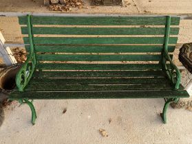 A green painted garden bench, with metal ends, 220