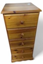 An orange pine chest of five short drawers, 96.5cm