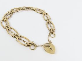 A 9ct gold twisted three bar gate bracelet, with h