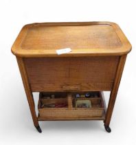 A mid-20th century sewing box on stand and content